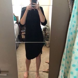 Little black dress . Mid length . Form fitting .